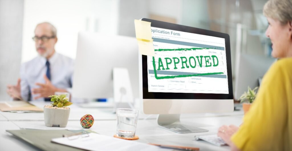 A woman is sitting in front of the desktop to check the approved peptide merchant account for the peptide business.